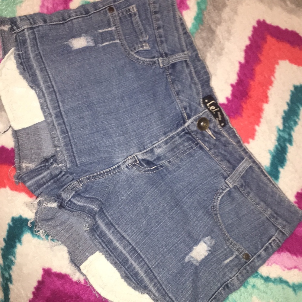 Cute blue jean shorts with pockets in front show